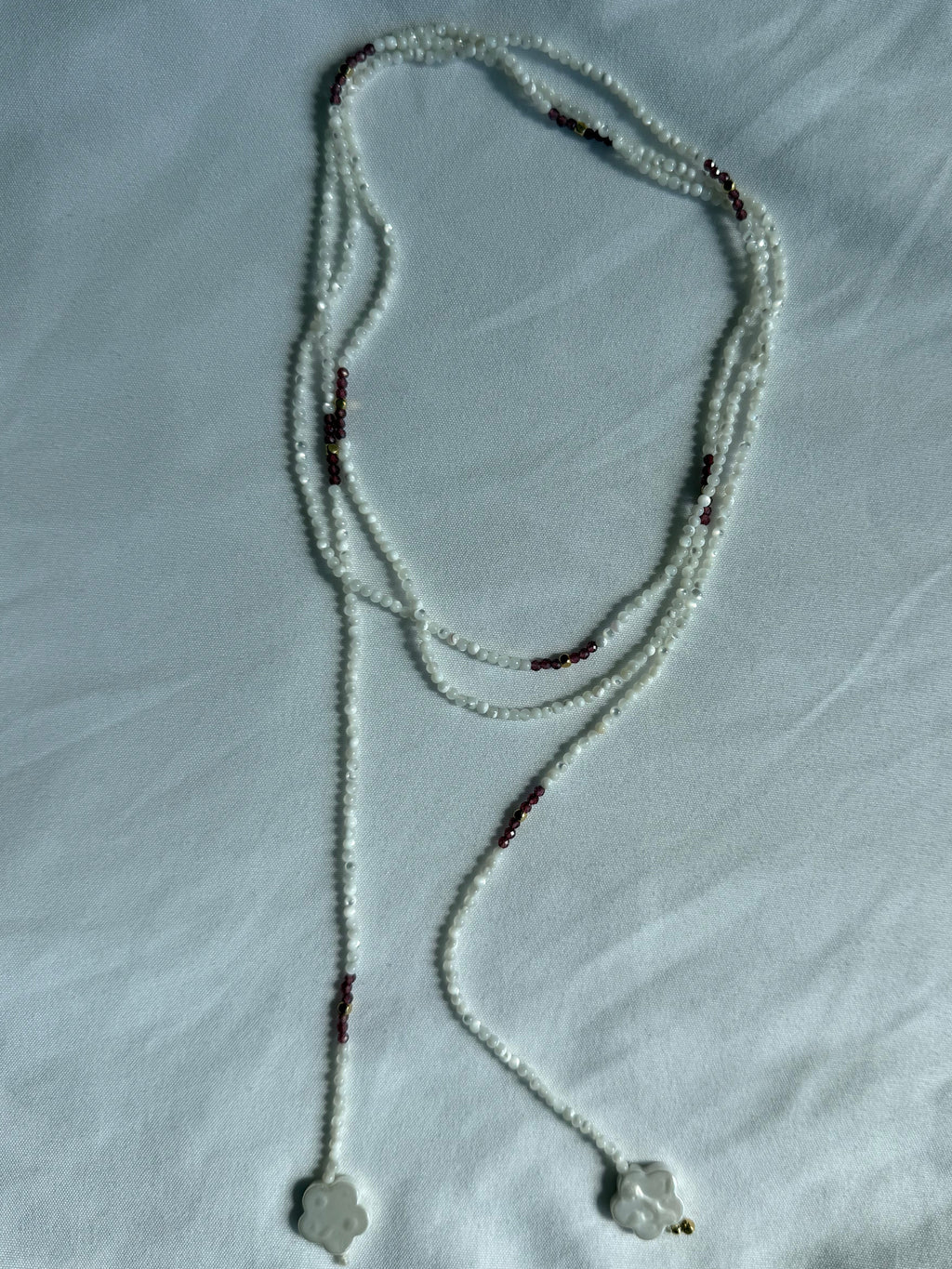 Mother of pearl, garnet and gold wrap lariat necklace