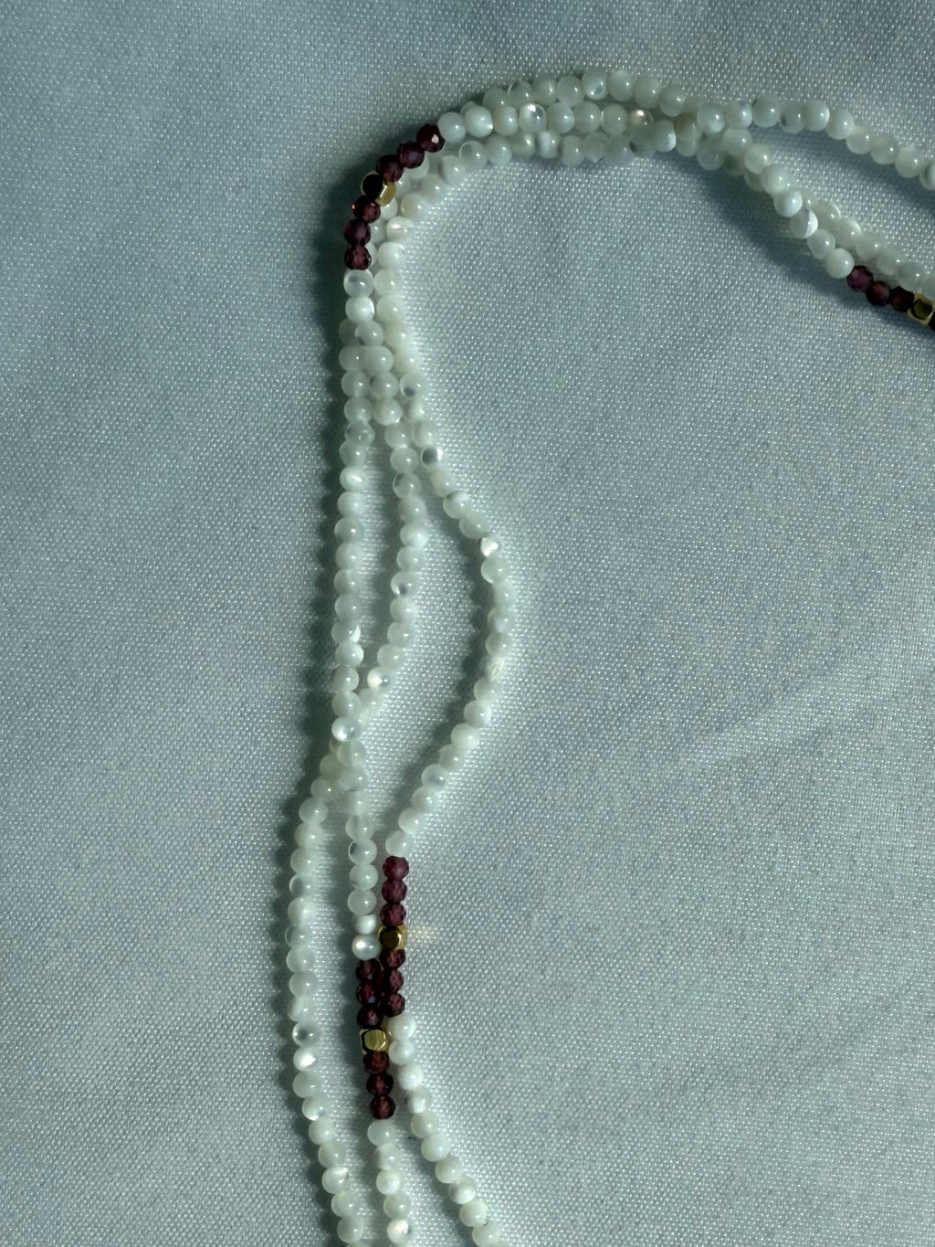 Mother of pearl, garnet and gold wrap lariat necklace