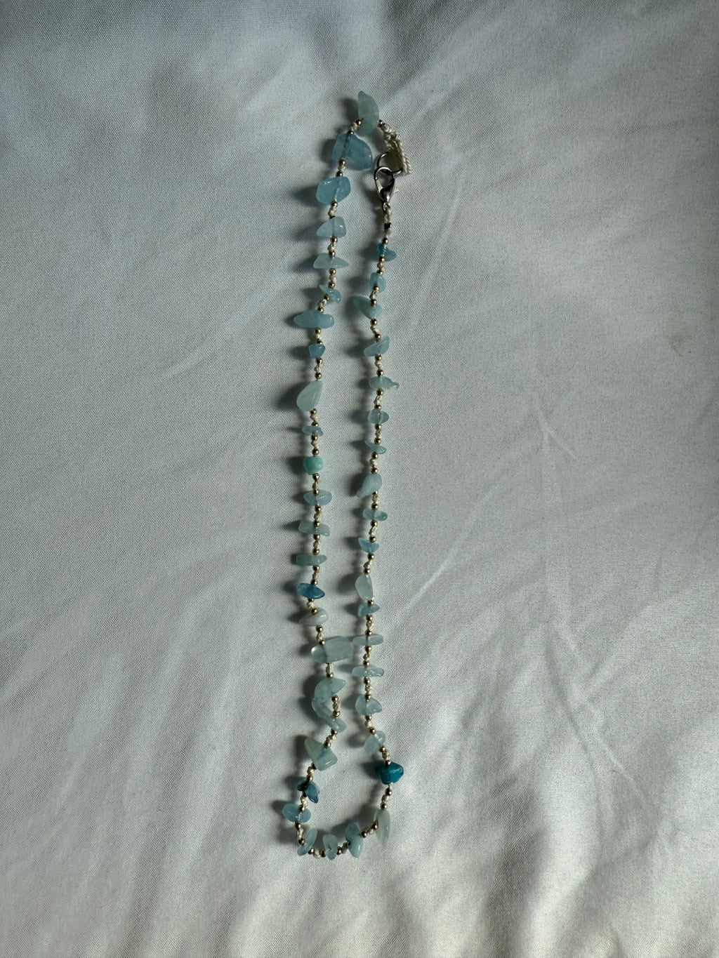 Natural blue gemstone and gold beaded necklace