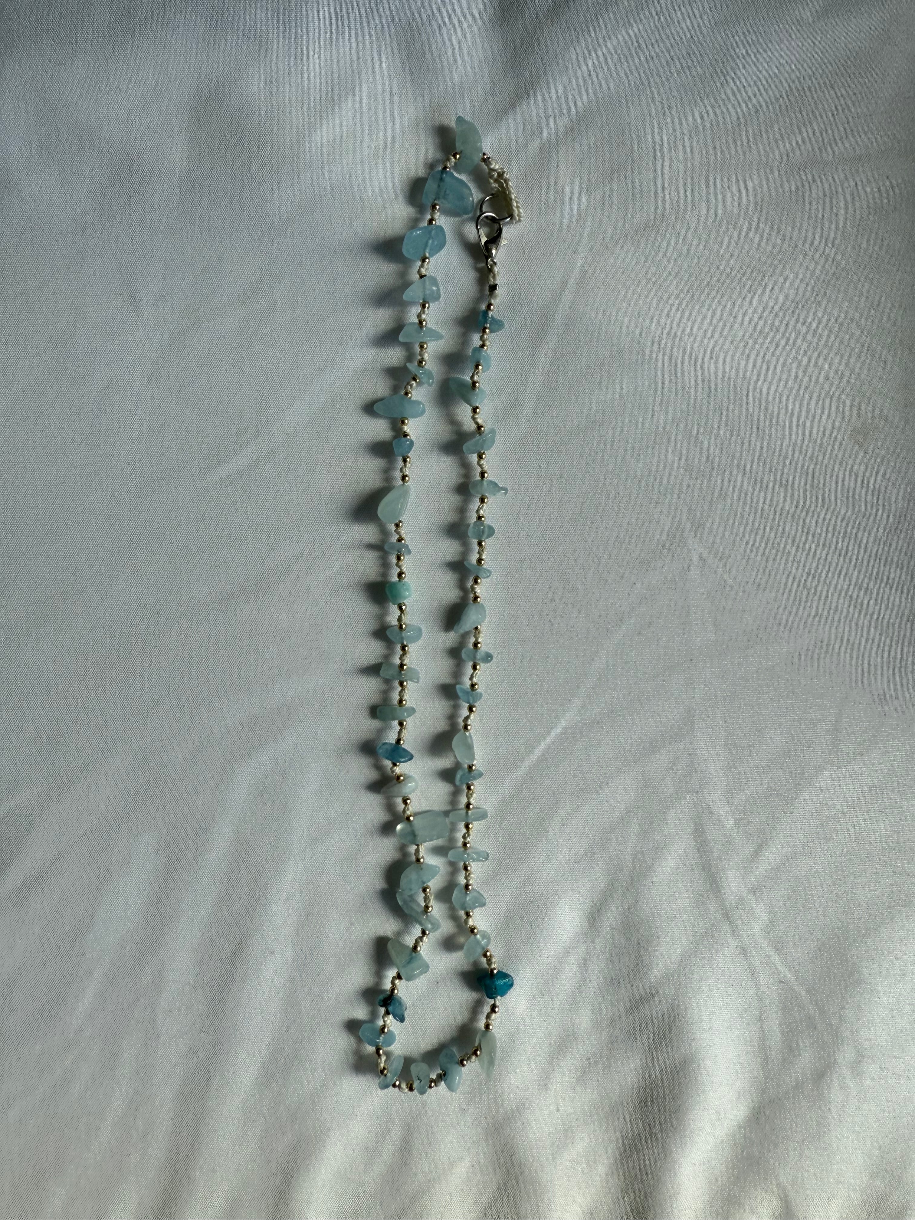 Natural blue gemstone and gold beaded necklace