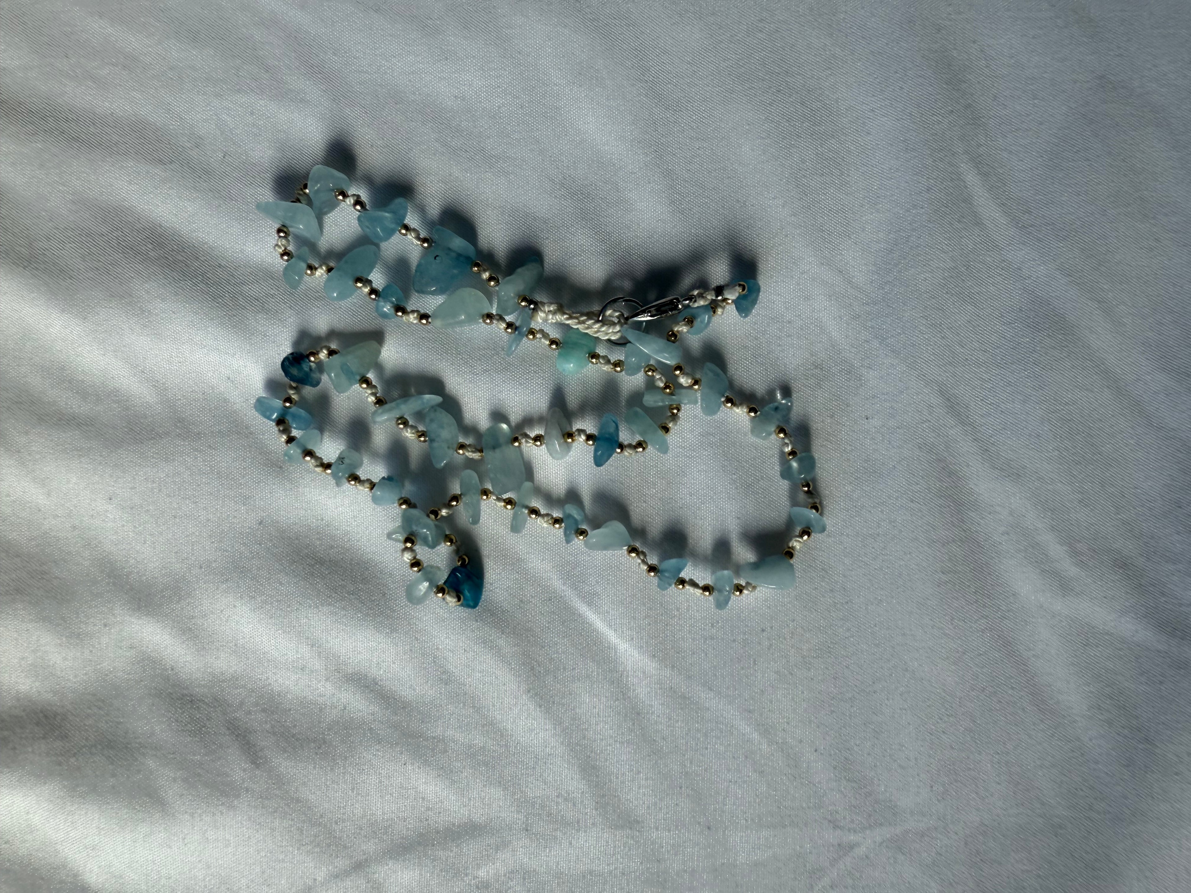 Natural blue gemstone and gold beaded necklace